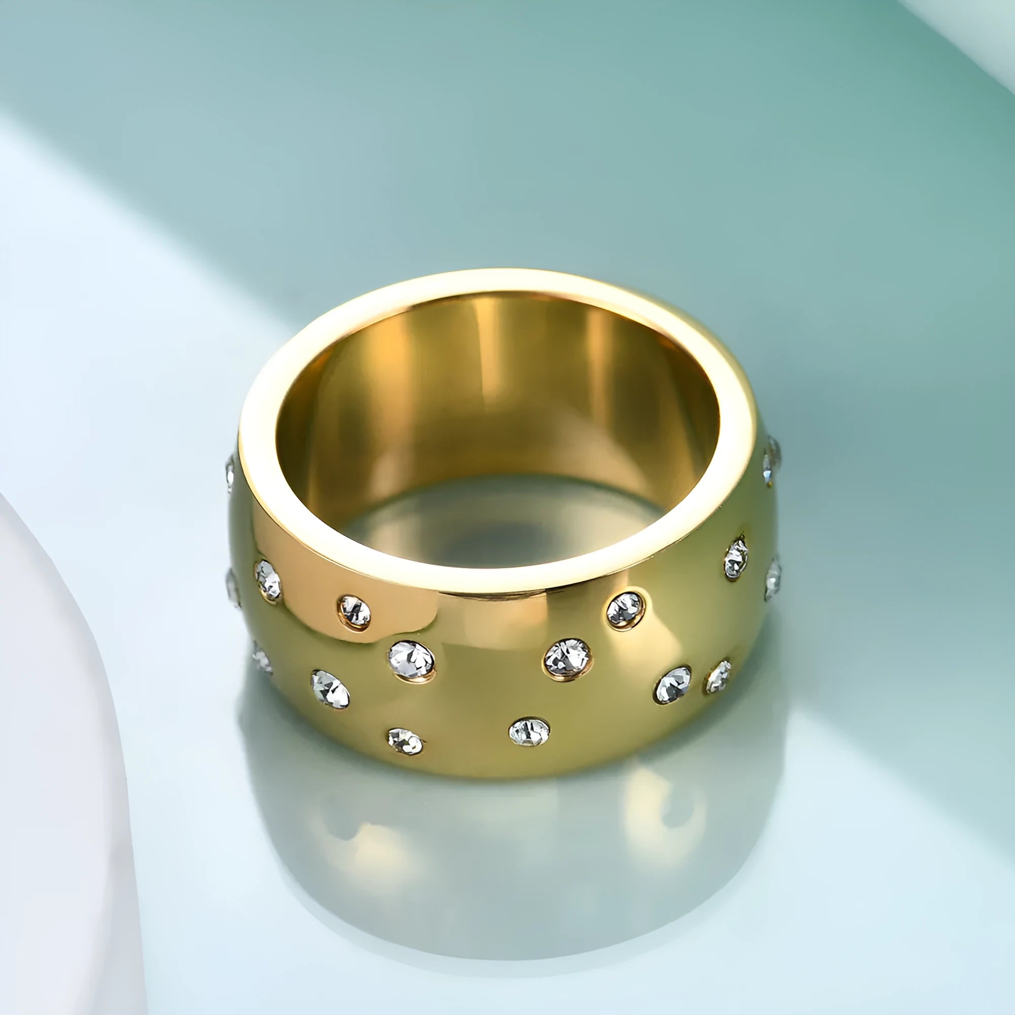 Titanium steel women's couple ring with diamond treatment in a geometric design, showing colour options.