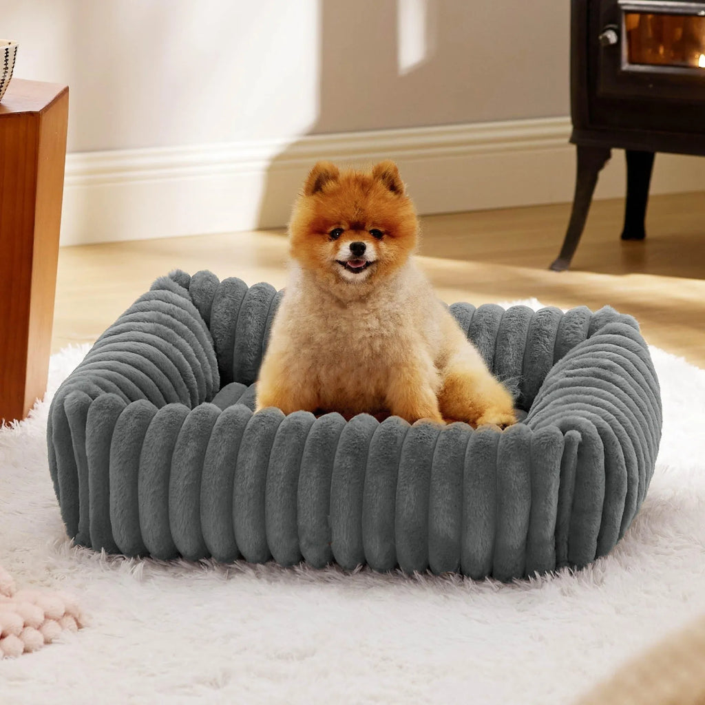 Dog bed with removable cover in beige colour showing four available size options