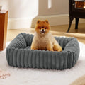 Dog bed with removable cover in beige colour showing four available size options