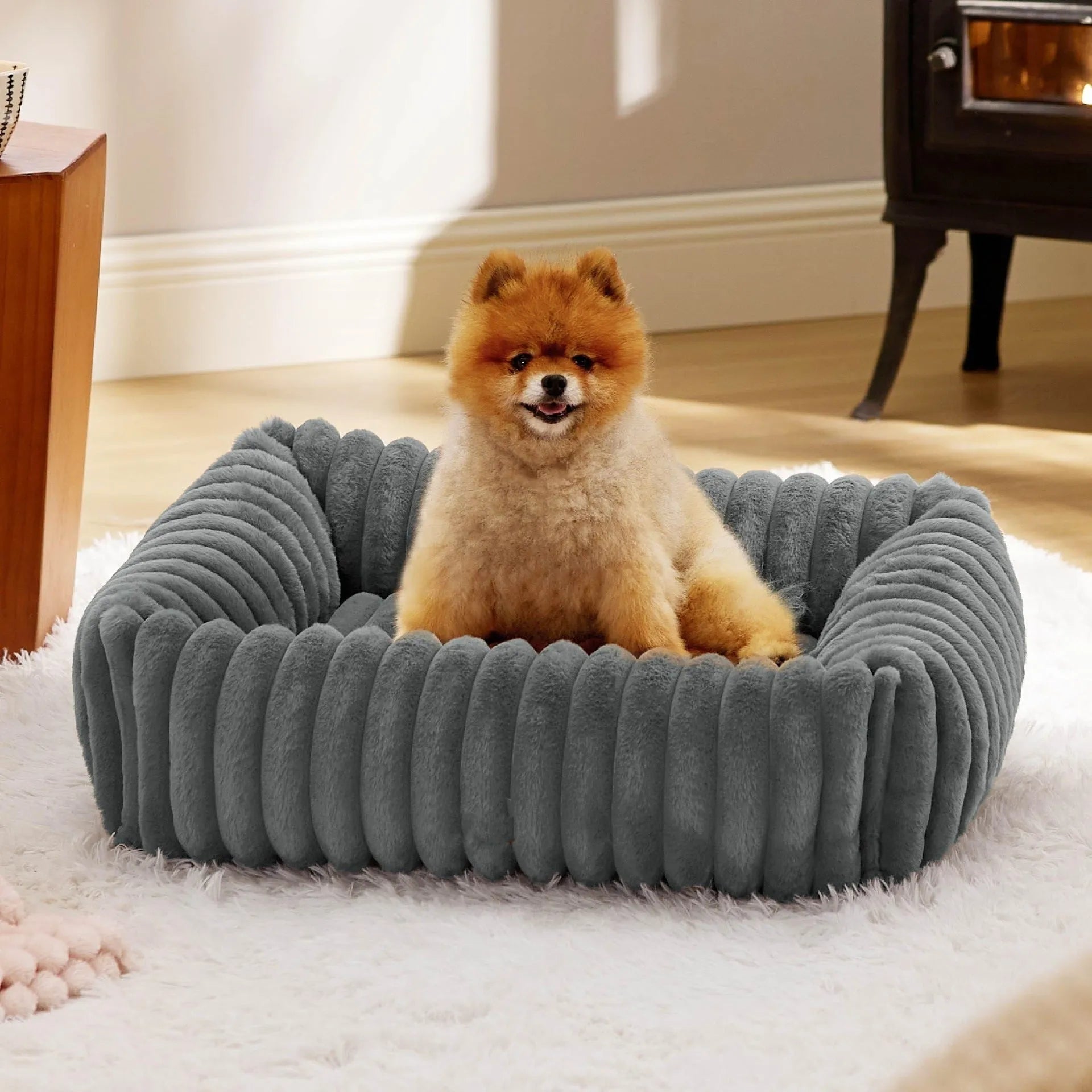 Dog bed with removable cover in beige colour showing four available size options