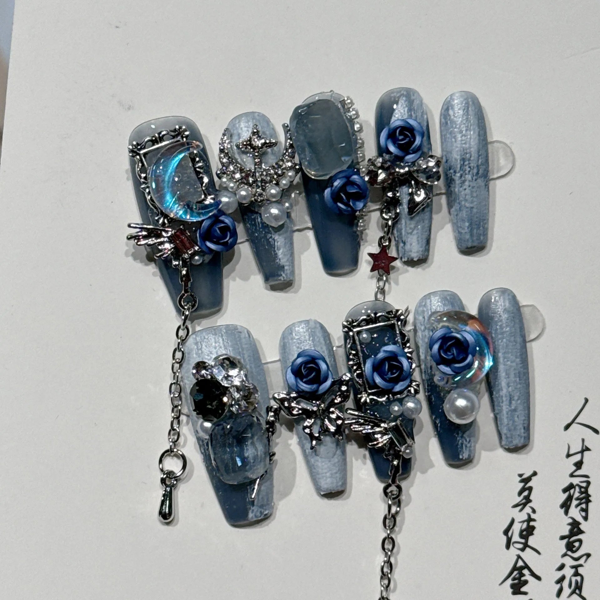 Evening manicure set with rose and tulip patterns in night blue colour featuring plastic armour suit
