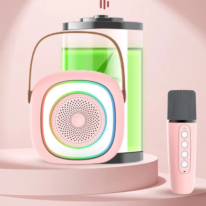 Wireless karaoke microphone with LED lights held next to its separate Bluetooth audio unit