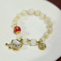 Women's Chinese style coloured glaze glass bracelet with safety lock, windmill, and bamboo charms