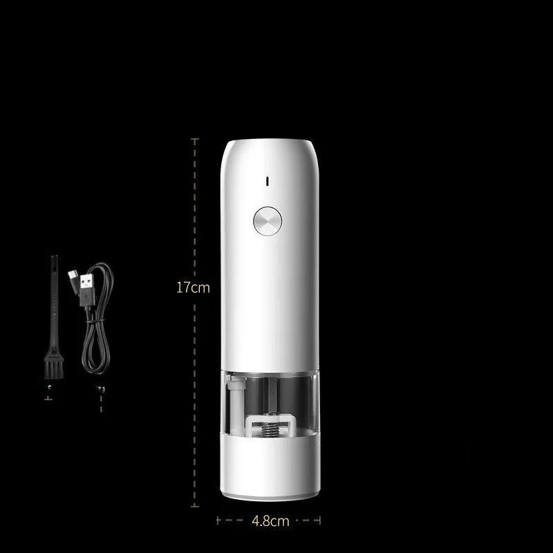 Black and silver rechargeable electric pepper grinder with clear acrylic body on a kitchen counter
