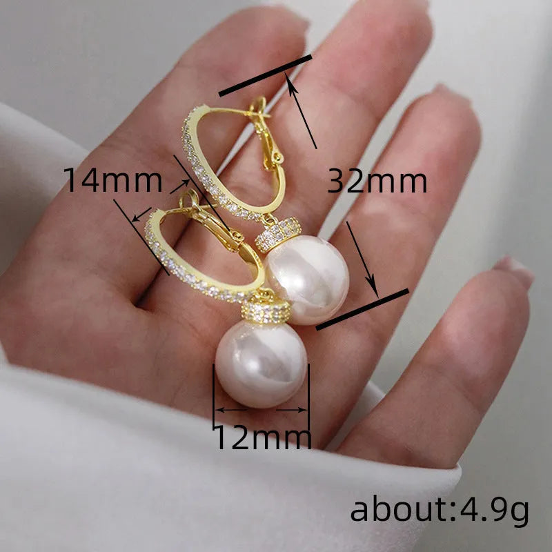 Yellow gold copper earrings with imitation pearl and inlaid zircon geometric ring design
