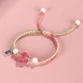 Red cat's paw woven couple bracelet with glass and coloured glaze in pastoral style