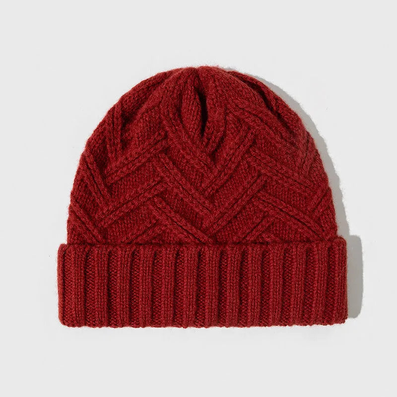 Wool knitted women's winter hat with dome crown and totem pattern in ivory white colour