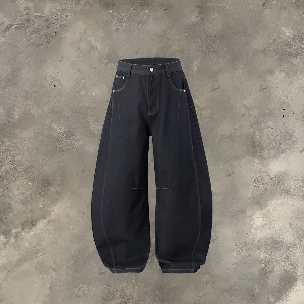 Men's wide leg denim trousers in original cow colour, showing mid-waist and relaxed fit.
