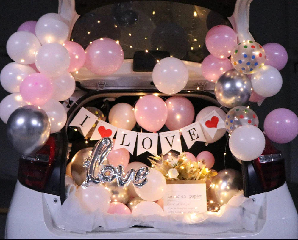 Romantic car trunk proposal decoration kit with balloons, ribbons, and accessories for creating a magical surprise