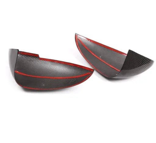True carbon fibre exterior rearview mirror covers for a black Porsche Macan.