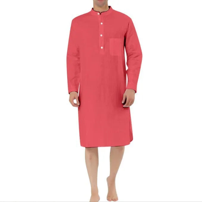 Man wearing a light blue cotton shirt robe with front pockets, showing the full-length opening and relaxed fit.