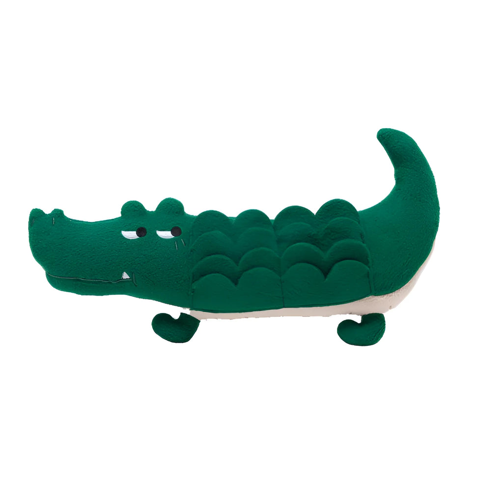 Green plush stuffed toy dog on white background, showing soft texture and size.