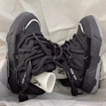 Women's grey clunky sneakers with thick rubber sole and round toe, shown with blue and black colour options.