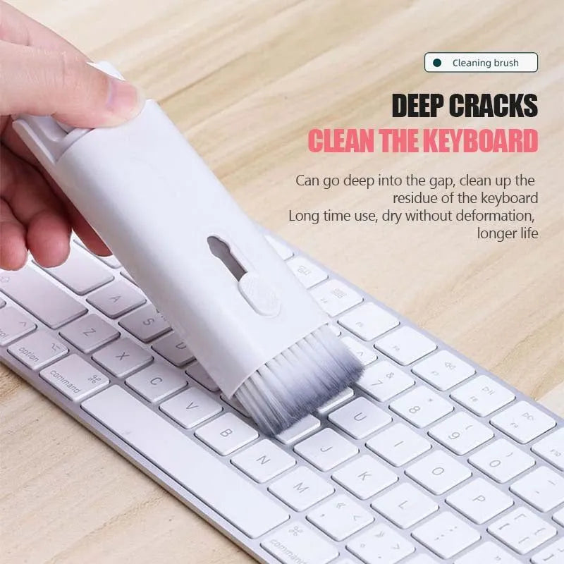 Multifunction electronics cleaning kit with foldable pen, spray bottle, brush, and keycap puller on a white background.
