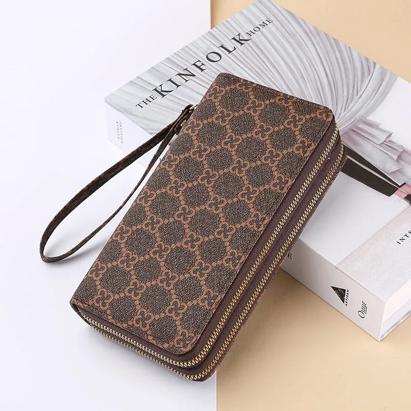 Long PU leather wallet clutch with zip closure and retro print decoration showing internal compartments
