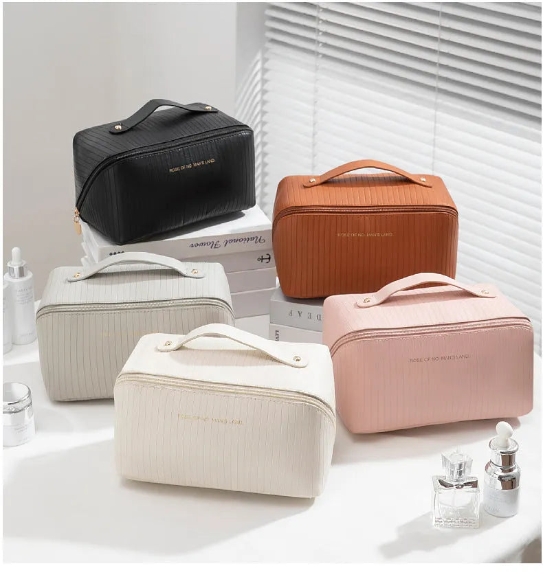 Vertical pattern pillow makeup bag in PU material measuring 22.5cm cubic for travel storage