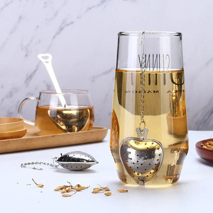 Heart-shaped stainless steel tea infuser with chain, perfect for steeping loose-leaf teas and spices