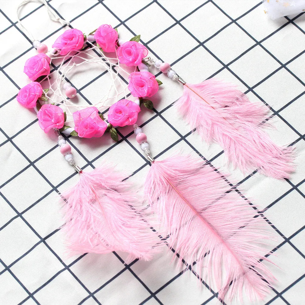 Pink ostrich feather dreamcatcher wind chime measuring 10cm for wall decoration