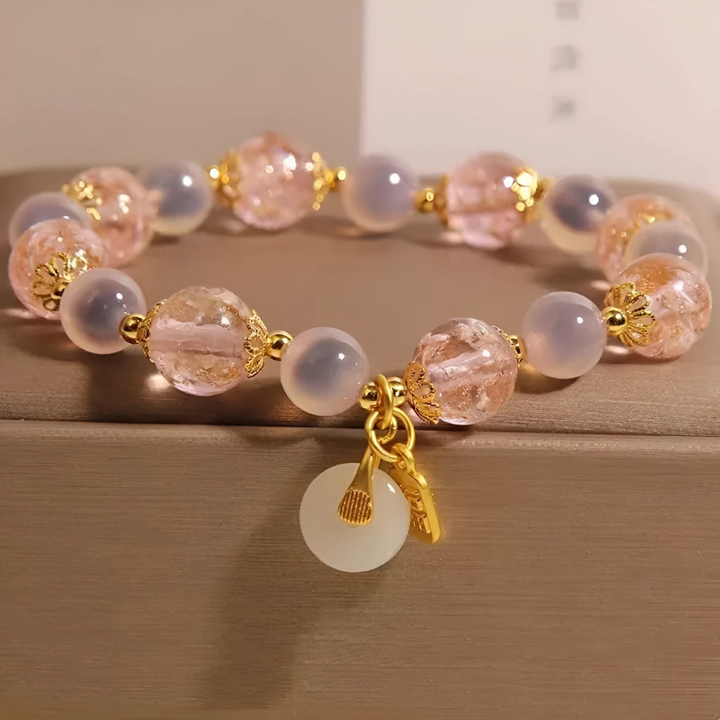 Women's pink heart agate bracelet with peace buckle closure and luminous glaze details