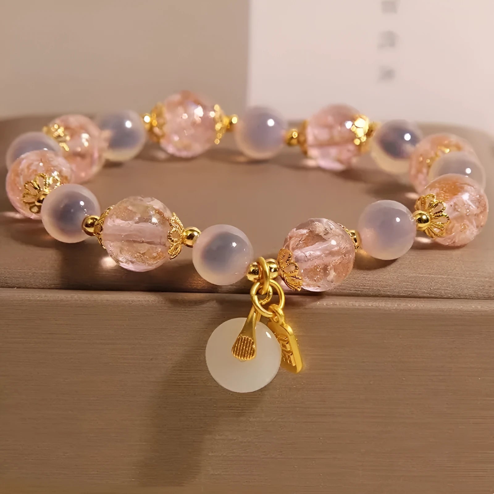 Women's pink heart agate bracelet with peace buckle closure and luminous glaze details