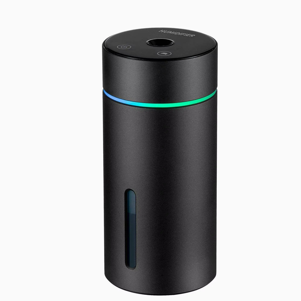 Compact aluminium car air humidifier and essential oil diffuser with night light on wooden desk