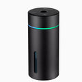 Compact aluminium car air humidifier and essential oil diffuser with night light on wooden desk
