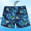 Men's loose fit anti-embarrassment swimming trunks in dark blue background big flower pattern, polyester fabric