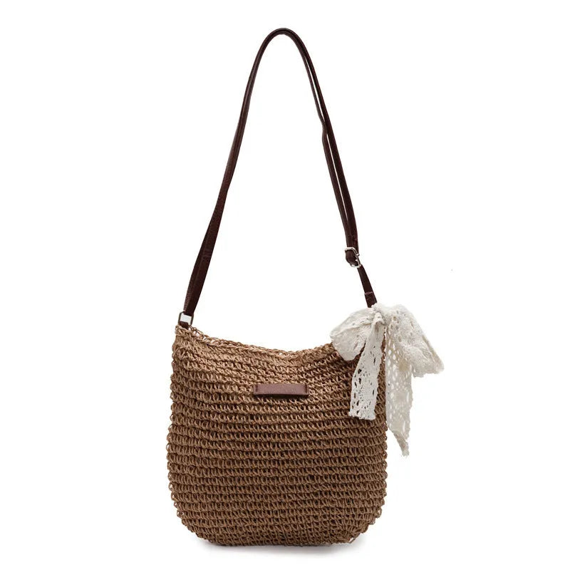 Women's woven straw messenger bag in khaki colour with shoulder strap