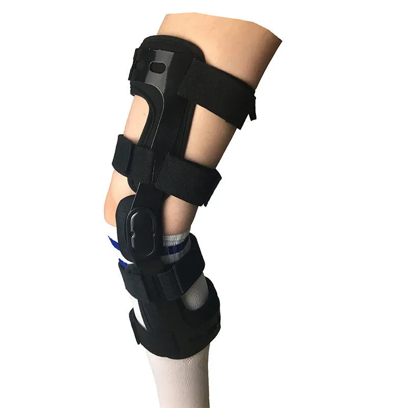 Black anterior ligament knee pad and supporter showing brushed cloth exterior with sponge cushioning