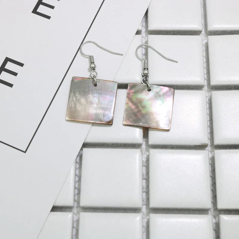 Natural shell geometric earrings in square panther and rectangular shell designs