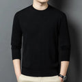 Man wearing a round neck grey wool blend long sleeve pullover sweater.