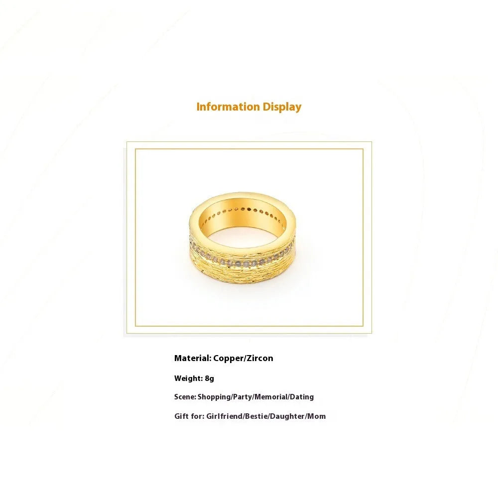Gold coloured geometric zircon ring for women on a plain background.