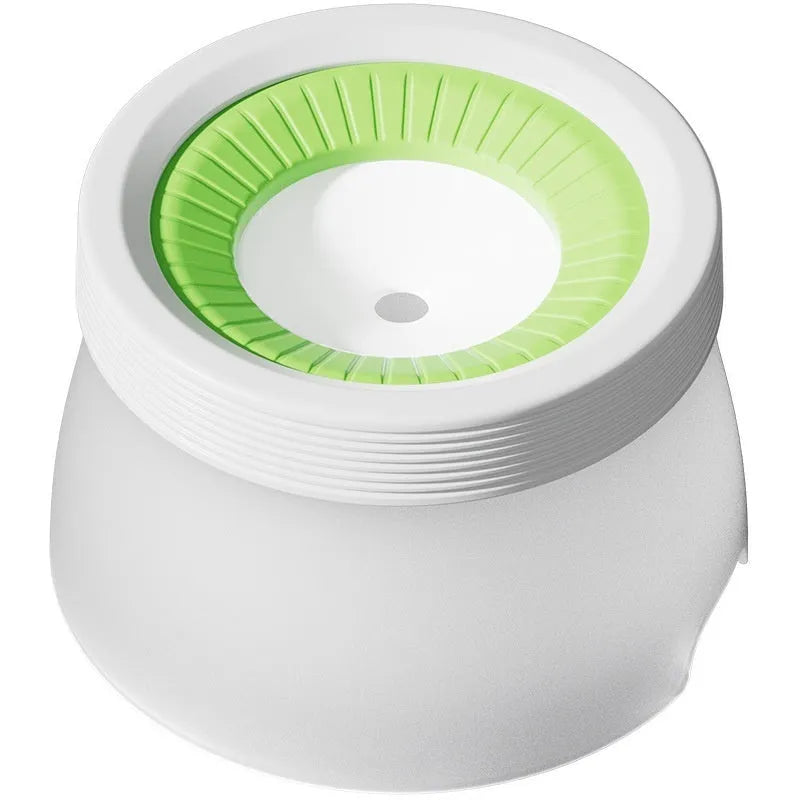 Suspended green pet water bowl for dogs and cats on a white plate base.