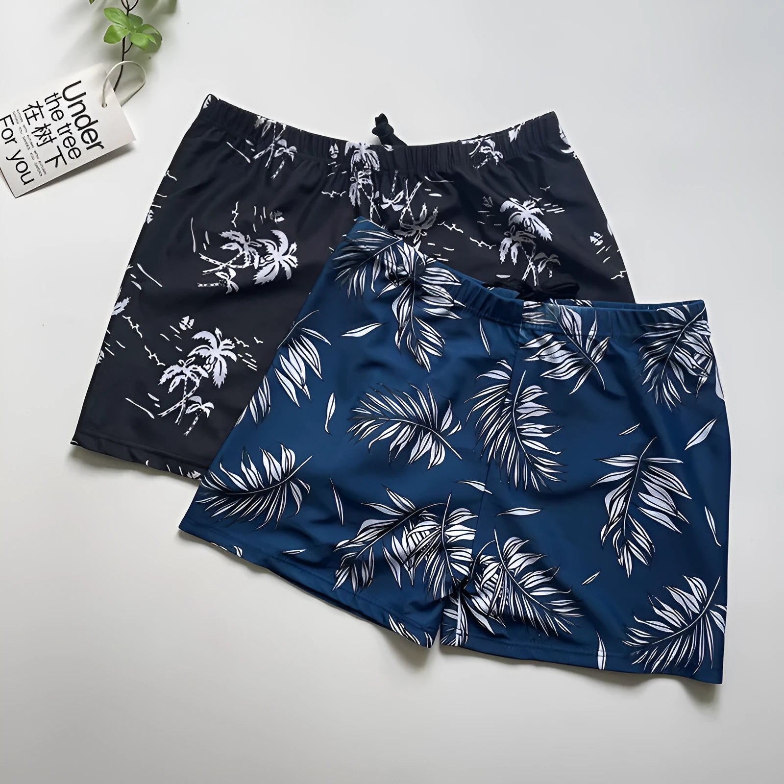 Men's loose fit anti-embarrassment swimming trunks in dark blue background big flower pattern, polyester fabric