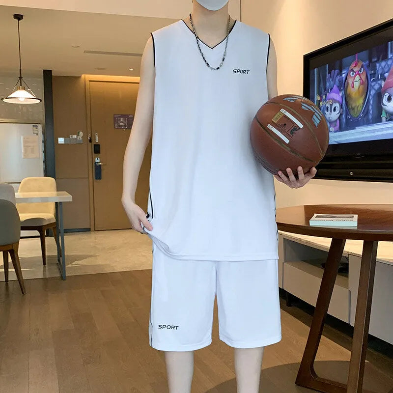 Men's grey polyester sleeveless basketball vest and matching shorts sports set laid flat