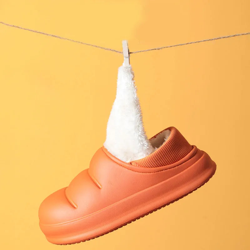Yellow waterproof EVA garden slippers with a plush lining and textured non-slip sole.