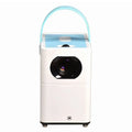 Smart HD home cinema projector with Android operating system and remote control on a table