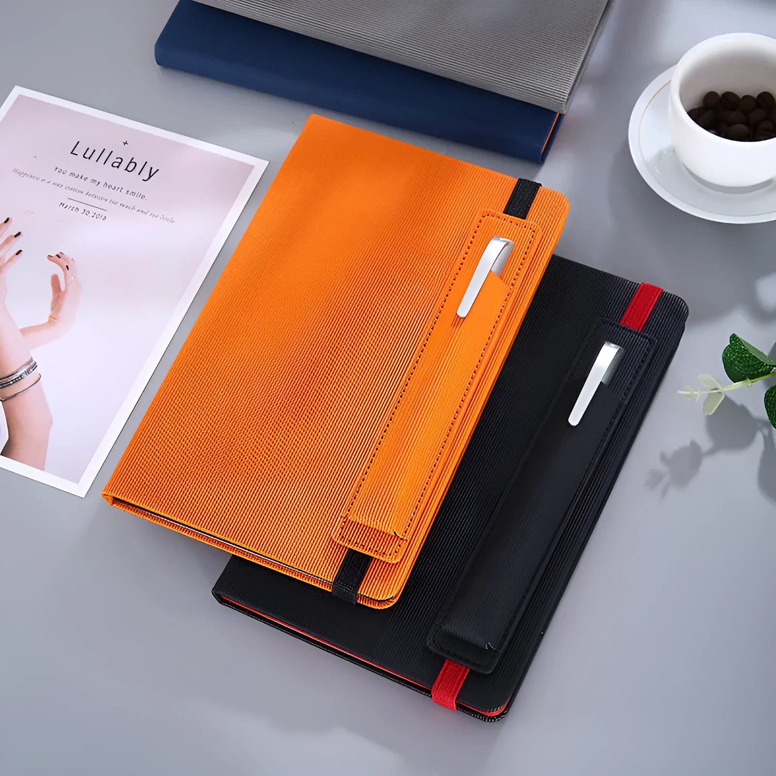 A5 faux leather notebook in blue with strap and pen insert, 200 pages, lying flat