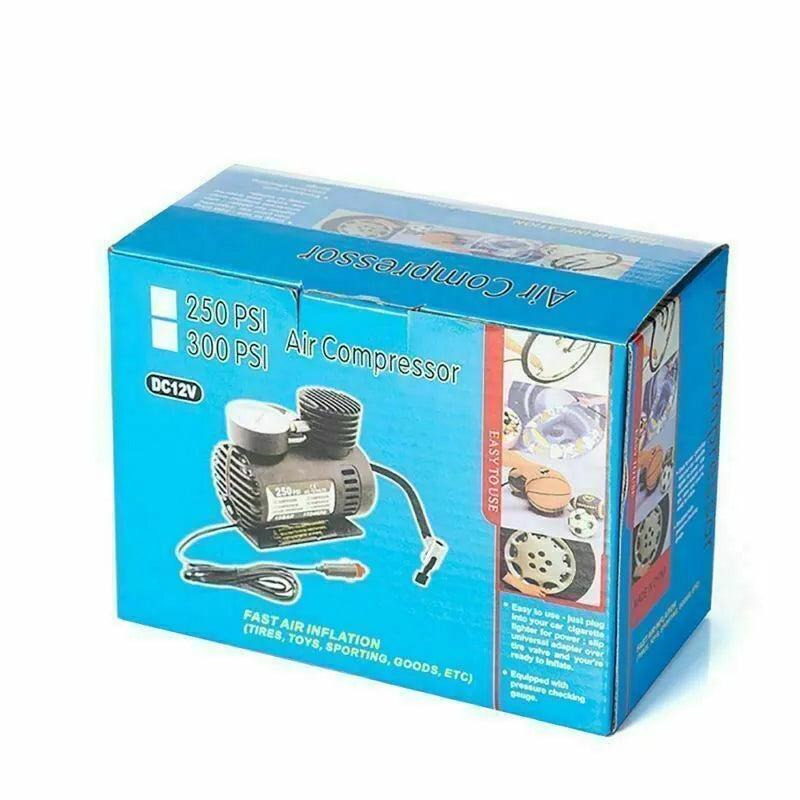 Black portable 12V mini car air compressor with pressure gauge, hose, and two nozzle adapters on grey background
