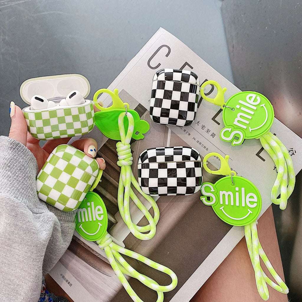 Black and green checkerboard pattern TPU protective case for Apple AirPods with pendant variations