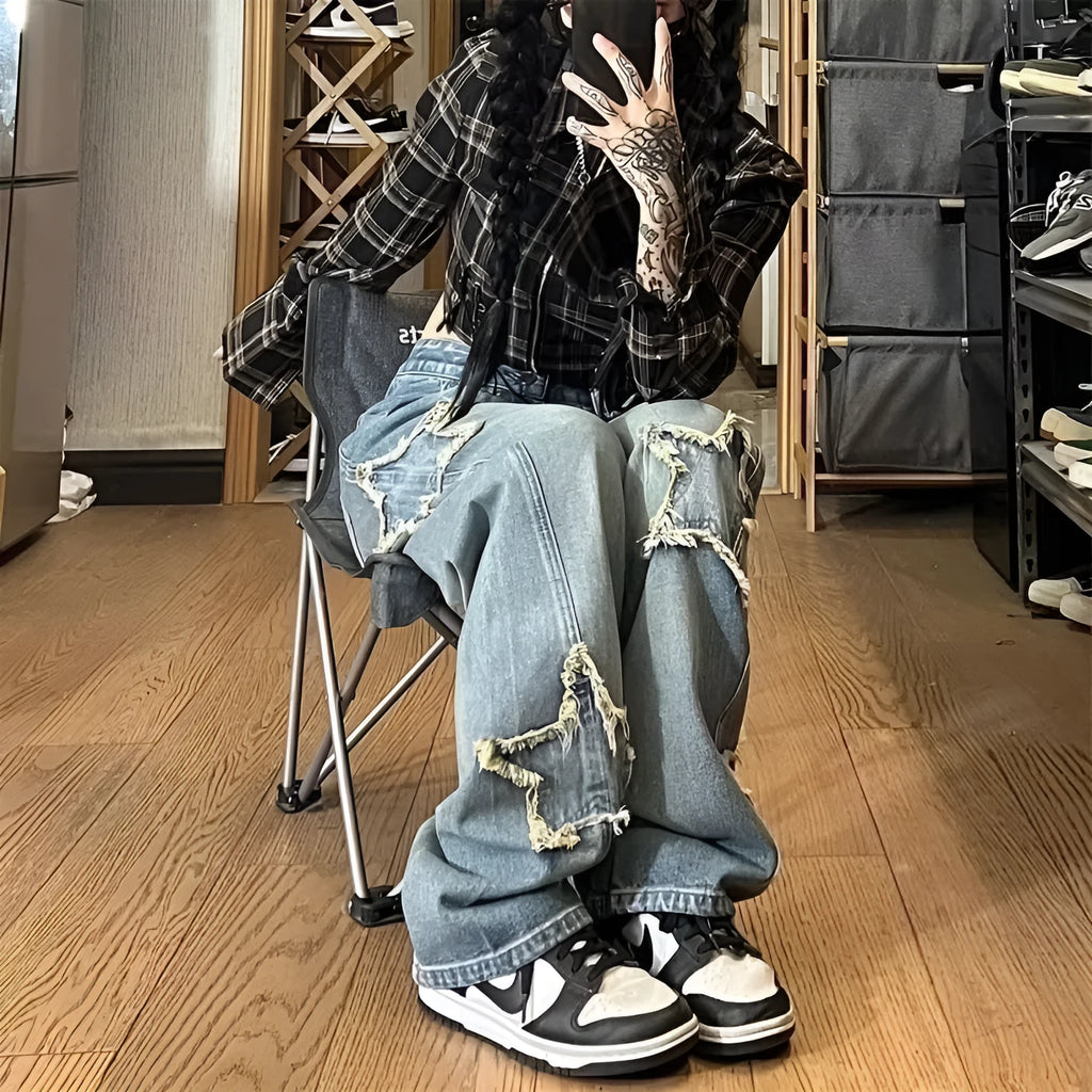 Blue high-waisted wide-leg denim jeans with straight-leg design on hanger