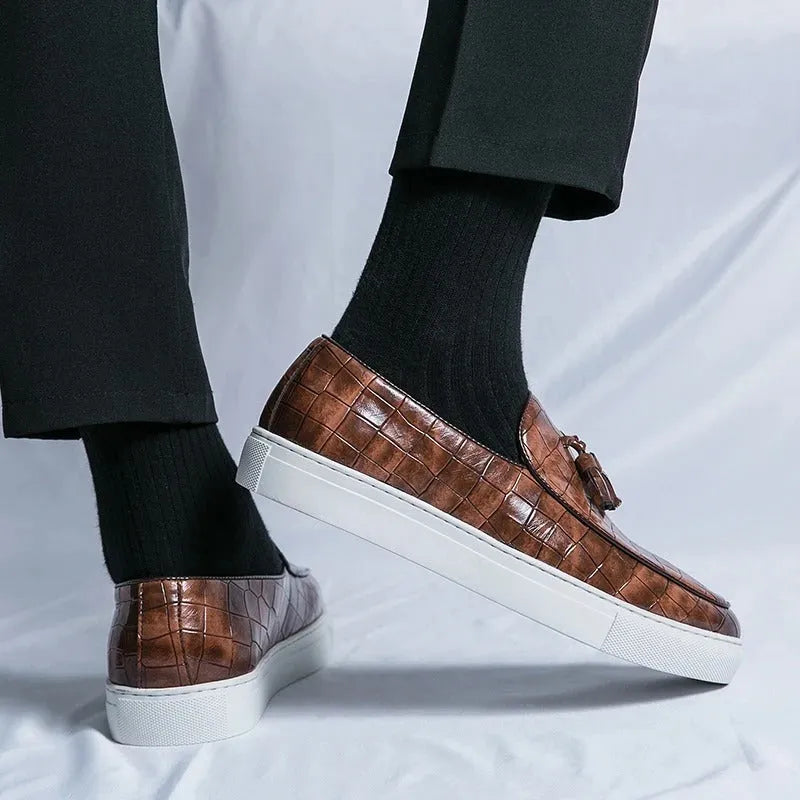 Men's black business casual sneakers with tassel detail on artificial PU leather upper