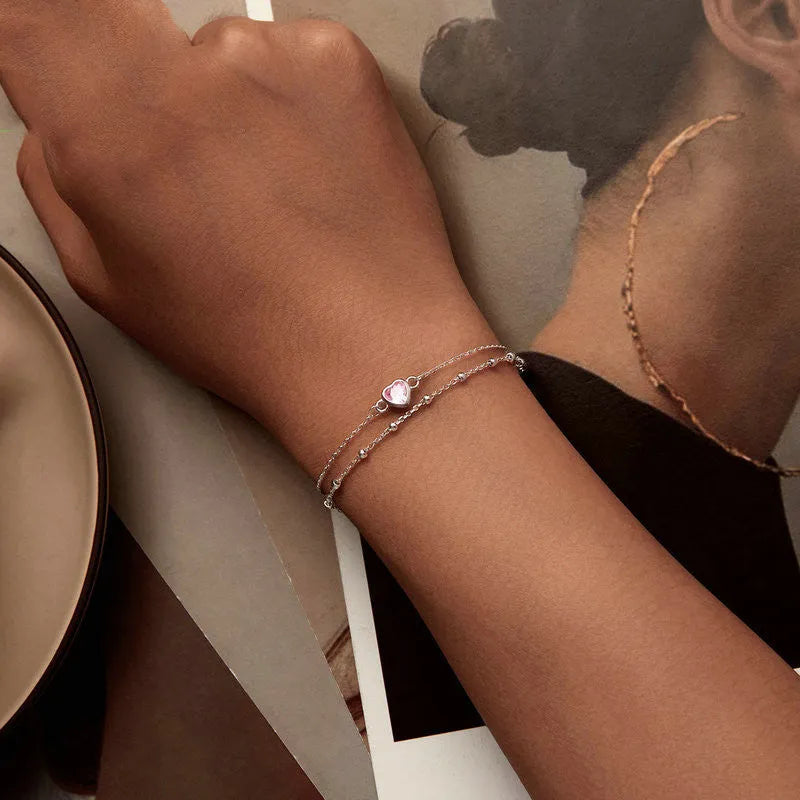 Sterling silver bracelet with heart pendant on adjustable chain
