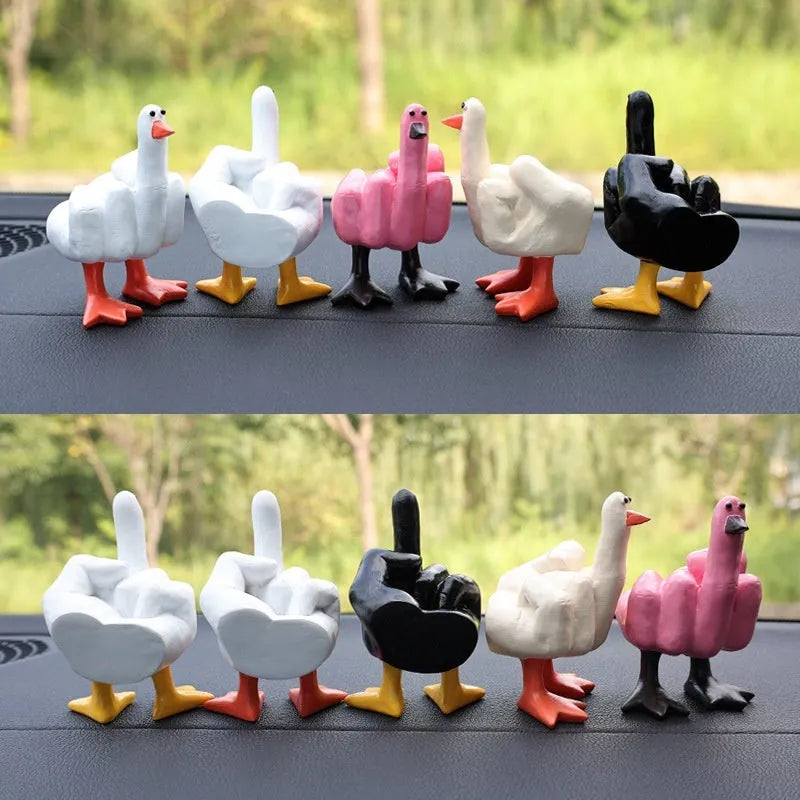 Creative middle finger duck cartoon resin ornament in beige, 50x77mm, on car centre console