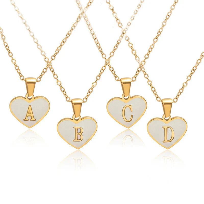 A personalized heart-shaped necklace with a 26-letter charm, crafted from high-quality stainless steel and gold plating.