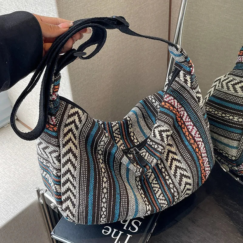 Women's ethnic style canvas dumpling crossbody bag in five colours.