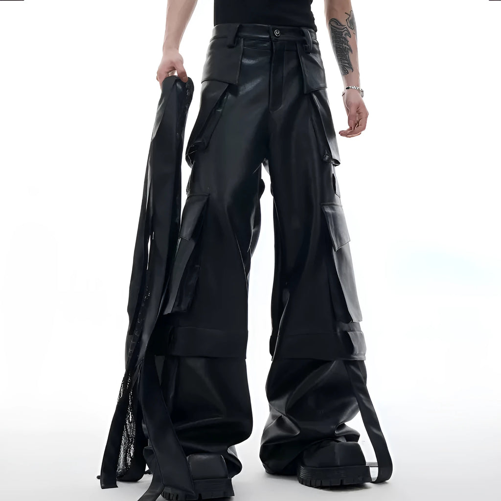 Black loose fit trousers with multi-pocket stitching and ribbon leather detailing on heavy composite fabric