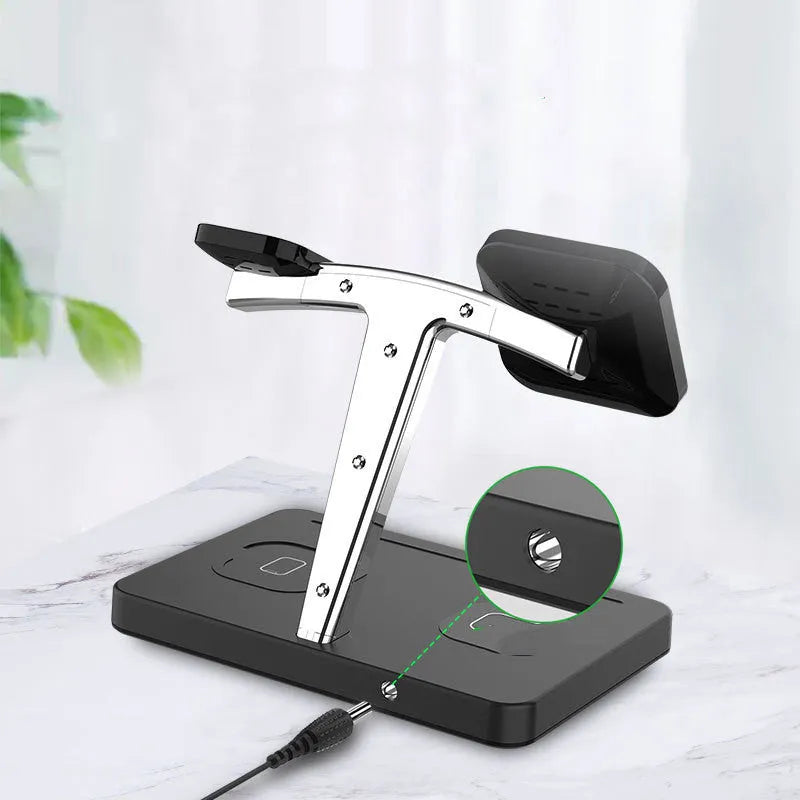 Four-in-one magnetic wireless charger in black with Type-C interface, showing indication function light on charging surface.