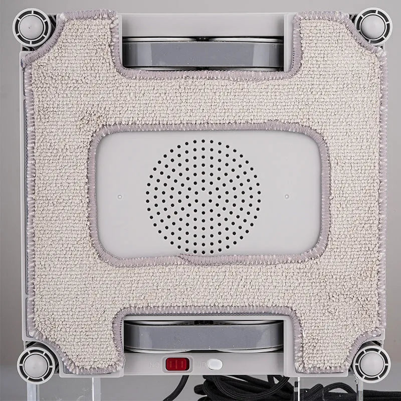 White intelligent window cleaning robot with four water spray nozzles for automated high-rise window maintenance