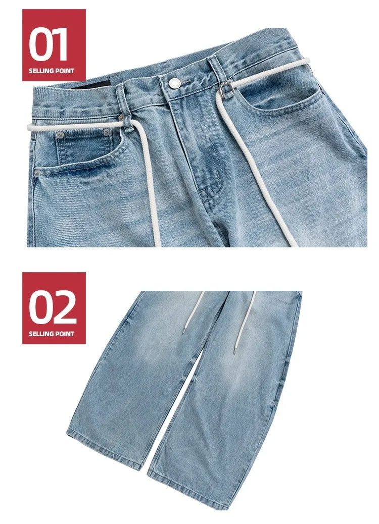 Blue vintage washed straight-leg denim trousers with a drawstring belt and zipper fly.